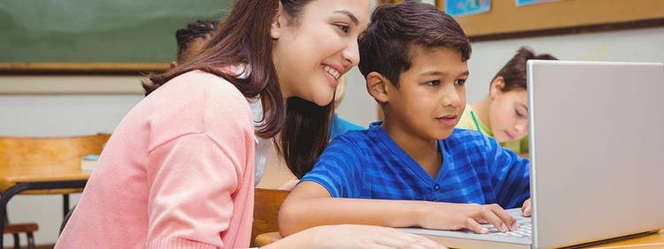 Teacher working with student