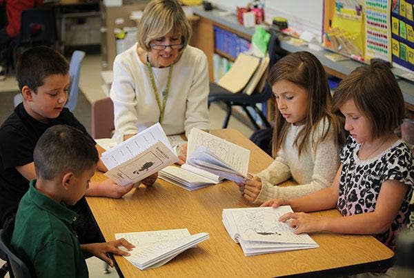 Teacher leading a small reading group