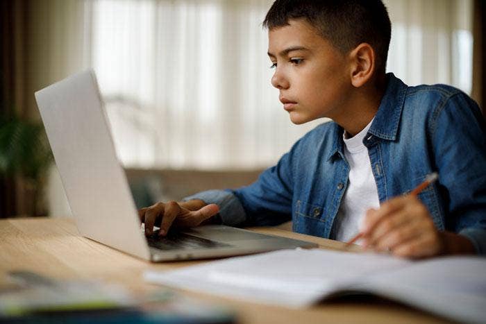 Student doing lesson at home.