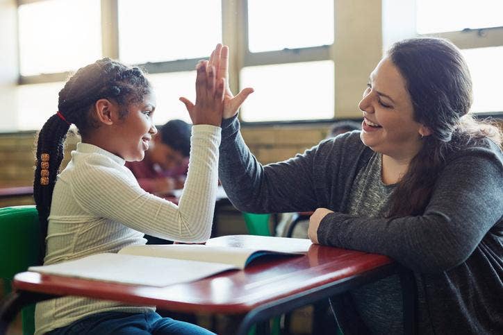 teacher and student high five