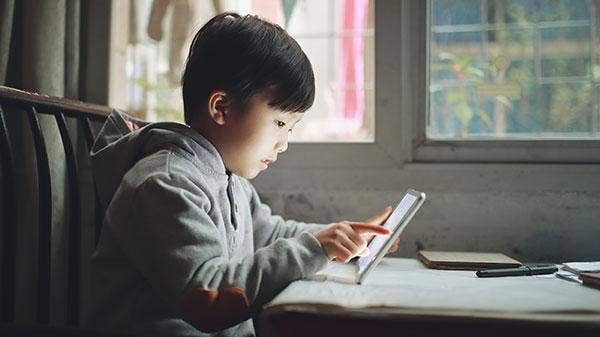 kid reading at home