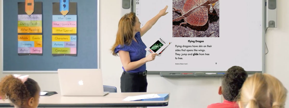 Teacher using Raz-Plus projectable book